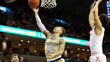 CHARLOTTESVILLE, VA - FEBRUARY 27: Jose Alvarado #10 of the Georgia Tech Yellow Jackets shoots past Kihei Clark #0 of the Virginia Cavaliers in the first half during a game at John Paul Jones Arena on February 27, 2019 in Charlottesville, Virginia. (Photo by Ryan M. Kelly/Getty Images)