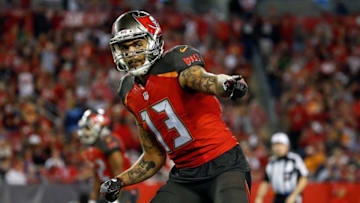 Dec 11, 2016; Tampa, FL, USA; Tampa Bay Buccaneers wide receiver Mike Evans (13) points against the New Orleans Saints during the second half at Raymond James Stadium. Tampa Bay Buccaneers defeated the New Orleans Saints 16-11. Mandatory Credit: Kim Klement-USA TODAY Sports