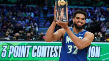 Minnesota Timberwolves center Karl-Anthony Towns holds the MTN DEW 3-Point Contest trophy after winning the competition. Mandatory Credit: Kyle Terada-USA TODAY Sports