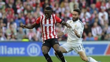 Athletic Bilbao's forward Inaki Williams (L) vies with Real Madrid's defender Daniel Carvajal during the Spanish league football match Athletic Club Bilbao vs Real Madrid CF at the San Mames stadium in Bilbao on March 7, 2015. AFP PHOTO/ ANDER GILLENEA (Photo credit should read ANDER GILLENEA/AFP/Getty Images)