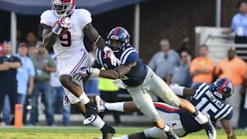 Sep 17, 2016; Oxford, MS, USA; Alabama Crimson Tide running back Bo Scarbrough (9) moves past Mississippi Rebels linebacker DeMarquis Gates (3) during the fourth quarter of the game at Vaught-Hemingway Stadium. Alabama won 48-43. Mandatory Credit: Matt Bush-USA TODAY Sports