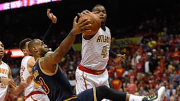 May 6, 2016; Atlanta, GA, USA; Cleveland Cavaliers forward LeBron James (23) and Atlanta Hawks forward Paul Millsap (4) fight for the ball during the second half in game three of the second round of the NBA Playoffs at Philips Arena. The Cavaliers defeated the Hawks 121-108. Mandatory Credit: Dale Zanine-USA TODAY Sports