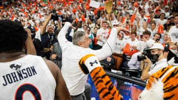Auburn basketball head coach Bruce Pearl does a cobra kai pose as he celebrates with fans after the game at Auburn Arena in Auburn, Ala., on Tuesday, Feb. 1, 2022. Auburn Tigers defeated Alabama Crimson Tide 100-81.