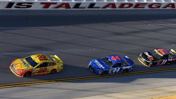 Oct 23, 2016; Talladega, AL, USA; NASCAR Sprint Cup Series driver Joey Logano (22) , driver Brian Scott (44) and driver Denny Hamlin (11) race out of turn four during the final lap of the Alabama 500 at Talladega Superspeedway. Mandatory Credit: John David Mercer-USA TODAY Sports
