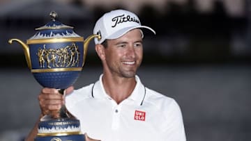 Mar 6, 2016; Miami, FL, USA; Adam Scott celebrates with the Cadillac Championship trophy the Gene Sarazen Cup following the final round at TPC Blue Monster at Trump National Doral. Mandatory Credit: John David Mercer-USA TODAY Sports