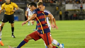 Jul 21, 2015; Los Angeles, CA, USA; Los Angeles Galaxy Ignacio Magnato (15) defends Barcelona forward Pedro (7) in the first half of the game at the Rose Bowl. Mandatory Credit: Jayne Kamin-Oncea-USA TODAY Sports