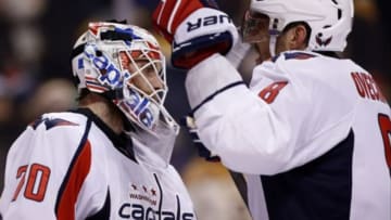 Jan 5, 2016; Boston, MA, USA; Washington Capitals left wing Alex Ovechkin (8) congratulates goalie Braden Holtby (70) after defeating the Boston Bruins 3-2 at TD Garden. Mandatory Credit: Greg M. Cooper-USA TODAY Sports