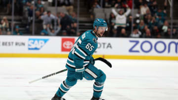 SAN JOSE, CALIFORNIA - APRIL 06: Erik Karlsson #65 of the San Jose Sharks skates back to congratulate Steven Lorentz #16 of the San Jose Sharks after Lorentz scored against the Colorado Avalanche in the second period at SAP Center on April 06, 2023 in San Jose, California. Karlsson assisted on the goal, and the assist was his 100th point of the season. (Photo by Ezra Shaw/Getty Images)