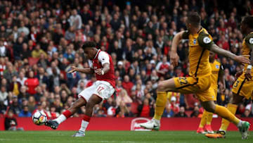 LONDON, ENGLAND - OCTOBER 01: Alex Iwobi of Arsenal scores his sides second goal as Shane Duffy of Brighton and Hove Albion attempts to block during the Premier League match between Arsenal and Brighton and Hove Albion at Emirates Stadium on October 1, 2017 in London, England. (Photo by Julian Finney/Getty Images)