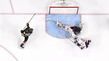 LAS VEGAS, NV - MAY 30: Braden Holtby #70 of the Washington Capitals makes a diving stick save on a shot by Alex Tuch #89 of the Vegas Golden Knights as John Carlson #74 of the Capitals defends in the third period of Game Two of the 2018 NHL Stanley Cup Final at T-Mobile Arena on May 30, 2018 in Las Vegas, Nevada. The Capitals defeated the Golden Knights 3-2. (Photo by Ethan Miller/Getty Images)