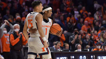 Feb 13, 2022; Champaign, Illinois, USA; Illinois Fighting Illini guard Trent Frazier (1) and teammate RJ Melendez (15) walk off the court after Sunday’s 73-66 win over Northwestern at State Farm Center. Mandatory Credit: Ron Johnson-USA TODAY Sports