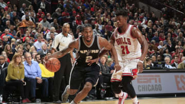 CHICAGO, IL - NOVEMBER 30: Kawhi Leonard #2 of the San Antonio Spurs drives to the basket against Jimmy Butler #21 of the Chicago Bulls during the game on November 30, 2015 at United Center in Chicago, Illinois. NOTE TO USER: User expressly acknowledges and agrees that, by downloading and or using this Photograph, user is consenting to the terms and conditions of the Getty Images License Agreement. Mandatory Copyright Notice: Copyright 2015 NBAE (Photo by Jeff Haynes/NBAE via Getty Images)