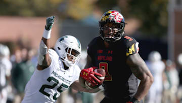 COLLEGE PARK, MD - NOVEMBER 03: Darrell Stewart Jr. #25 of the Michigan State Spartans forces a fumble on Byron Cowart #9 of the Maryland Terrapins during the second half at Capital One Field on November 3, 2018 in College Park, Maryland. (Photo by Will Newton/Getty Images)