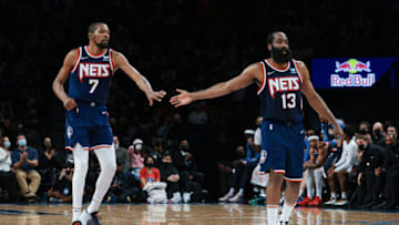 Nets forward Kevin Durant (7) slaps hands with guard James Harden (13): Vincent Carchietta-USA TODAY Sports