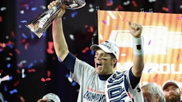 Feb 1, 2015; Glendale, AZ, USA; New England Patriots quarterback Tom Brady (12) celebrates with the Vince Lombardi Trophy after Super Bowl XLIX against the Seattle Seahawks at University of Phoenix Stadium. The Patriots defeated the Seahawks 28-24. Mandatory Credit: Kyle Terada-USA TODAY Sports