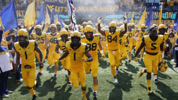 MORGANTOWN, WV - OCTOBER 06: West Virginia Mountaineers take the field before the game against the Kansas Jayhawks at Mountaineer Field on October 6, 2018 in Morgantown, West Virginia. (Photo by Joe Robbins/Getty Images)