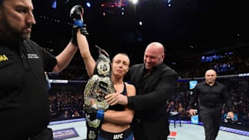 NEW YORK, NY - NOVEMBER 04: Dana White presents Rose Namajunas with the championship belt following her victory over Joanna Jedrzejczyk of Poland in their UFC women's strawweight championship bout during the UFC 217 event at Madison Square Garden on November 4, 2017 in New York City. (Photo by Josh Hedges/Zuffa LLC/Zuffa LLC via Getty Images)