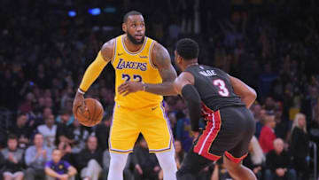 LeBron James #23 of the Los Angeles Lakers is guarded by Dwyane Wade #3 of the Miami Heat in Wade's last regular season game at Staples Center, (Photo by Harry How/Getty Images)