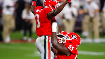 ATHENS, GA - OCTOBER 03: Zamir White #3 of the Georgia Bulldogs reacts with Trey Hill #55 after as touchdown during the second quarter of a game against the Auburn Tigers at Sanford Stadium on October 3, 2020 in Athens, Georgia. (Photo by Todd Kirkland/Getty Images)