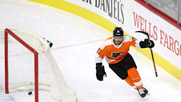 PHILADELPHIA, PENNSYLVANIA - JANUARY 30: Scott Laughton #21 of the Philadelphia Flyers celebrates after he scored the game winning goal in overtime against the New York Islanders at Wells Fargo Center on January 30, 2021 in Philadelphia, Pennsylvania.The Philadelphia Flyers defeated the New York Islanders 3-2 in overtime. (Photo by Elsa/Getty Images)