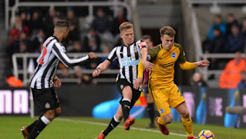 NEWCASTLE UPON TYNE, ENGLAND - DECEMBER 30: Matt Ritchie of Newcastle United and Solly March of Brighton and Hove Albion battle for possession during the Premier League match between Newcastle United and Brighton and Hove Albion at St. James' Park on December 30, 2017 in Newcastle upon Tyne, England. (Photo by Mark Runnacles/Getty Images)