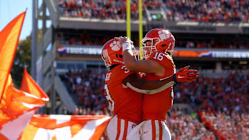 CLEMSON, SC - NOVEMBER 03: Teammates Trevor Lawrence #16 and Amari Rodgers #3 of the Clemson Tigers celebrate after a touchdown against the Louisville Cardinals during their game at Clemson Memorial Stadium on November 3, 2018 in Clemson, South Carolina. (Photo by Streeter Lecka/Getty Images)
