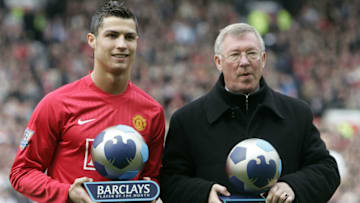Manchester United's Portuguese midfielder Cristiano Ronaldo (L) and manager Sir Alex Ferguson receive their player and manager of the month awards before their English Premier League football match against Arsenal at Old Trafford in Manchester, north west England on April 13, 2008. AFP PHOTO/PAUL ELLIS - Mobile and website use of domestic English football pictures are subject to obtaining a Photographic End User Licence from Football DataCo Ltd Tel : +44 (0) 207 864 9121 or e-mail accreditations@football-dataco.com - applies to Premier and Football League matches. (Photo credit should read PAUL ELLIS/AFP via Getty Images)