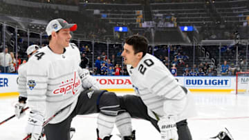 ST LOUIS, MISSOURI - JANUARY 25: John Carlson #74 of the Washington Capitals talks to Chris Kreider #20 of the New York Rangers during warmups before the start of the 2020 NHL All-Star Game at the Enterprise Center on January 25, 2020 in St Louis, Missouri. (Photo by Brian Babineau/NHLI via Getty Images)