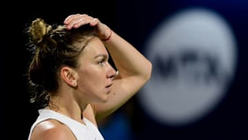 Romania's Simona Halep reacts during her match with US' Jennifer Brady during their Dubai Tennis Championships semi-final match in the Gulf emirate on February 21, 2020. (Photo by - / AFP) (Photo by -/AFP via Getty Images)