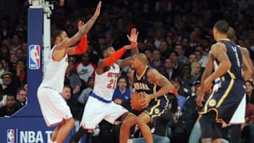 Mar 19, 2014; New York, NY, USA; Indiana Pacers power forward David West (21) controls the ball while defended by New York Knicks shooting guard Iman Shumpert (21) and New York Knicks center Tyson Chandler (6) during the second quarter of a game at Madison Square Garden. Mandatory Credit: Brad Penner-USA TODAY Sports