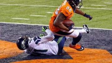 Feb 2, 2014; East Rutherford, NJ, USA; Denver Broncos wide receiver Demaryius Thomas (88) scores a touchdown against Seattle Seahawks cornerback Byron Maxwell (41) during the third quarter in Super Bowl XLVIII at MetLife Stadium. Mandatory Credit: Jim O