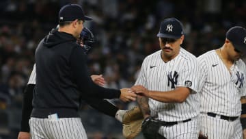 Oct 1, 2021; Bronx, New York, USA; New York Yankees starting pitcher Nestor Cortes (65) hands the ball to New York Yankees manager Aaron Boone (17) after being taken out of the game against the Tampa Bay Rays during the fifth inning at Yankee Stadium. Mandatory Credit: Andy Marlin-USA TODAY Sports