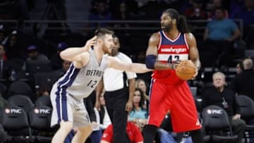 Nov 21, 2015; Auburn Hills, MI, USA; Washington Wizards forward Nene Hilario (42) defended by Detroit Pistons forward Aron Baynes (12) during the fourth quarter at The Palace of Auburn Hills. Wizards win 97-95. Mandatory Credit: Raj Mehta-USA TODAY Sports