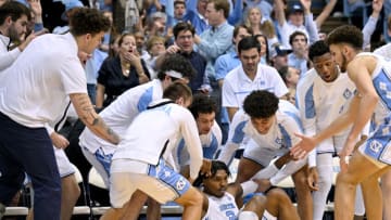 CHAPEL HILL, NORTH CAROLINA - FEBRUARY 11: Teammates help up Caleb Love #2 of the North Carolina Tar Heels after a three-point basket against the Clemson Tigers during the second half of their game at the Dean E. Smith Center on February 11, 2023 in Chapel Hill, North Carolina. (Photo by Grant Halverson/Getty Images)