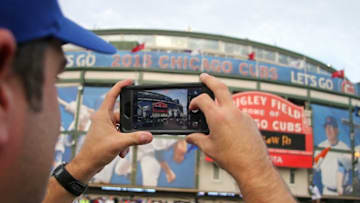 Oct 20, 2015; Chicago, IL, USA; A fan takes a cell phone picture of the outside of Wrigley Field prior to game three of the NLCS between the Chicago Cubs and the New York Mets. Mandatory Credit: Aaron Doster-USA TODAY Sports
