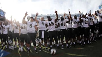 Nov 9, 2013; Gainesville, FL, USA; Vanderbilt Commodores quarterback Patton Robinette (4) celebrates with teammates after the game against the Florida Gators at Ben Hill Griffin Stadium. Mandatory Credit: Kim Klement-USA TODAY Sports