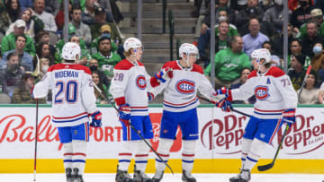 Jan 18, 2022; Dallas, Texas, USA; Montreal Canadiens defenseman Chris Wideman (20) and left wing Christian Dvorak (28) and center Nick Suzuki (14) and right wing Tyler Toffoli (73) celebrate a goal scored by Dvorak against the Dallas Stars during the second period at the American Airlines Center. Mandatory Credit: Jerome Miron-USA TODAY Sports