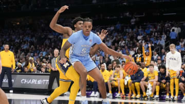 Dec 21, 2022; Charlotte, North Carolina, USA; North Carolina Tar Heels forward Armando Bacot (5) works the ball inside against the Michigan Wolverines during the first half at the Jumpman Classic at the Spectrum Center. Mandatory Credit: Jim Dedmon-USA TODAY Sports