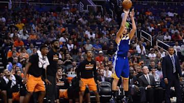 Oct 30, 2016; Phoenix, AZ, USA; Phoenix Suns bench players react as Golden State Warriors guard Klay Thompson (11) shoots the ball during the second half at Talking Stick Resort Arena. The Warriors won 106-100. Mandatory Credit: Joe Camporeale-USA TODAY Sports