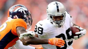 DENVER, CO - SEPTEMBER 16: Amari Cooper #89 of the Oakland Raiders is tackled after making a reception by Tramaine Brock #22 of the Denver Broncos at Broncos Stadium at Mile High on September 16, 2018 in Denver, Colorado. (Photo by Matthew Stockman/Getty Images)