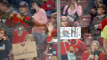 SUNRISE, FL - APRIL 8: Florida Panthers fans have messages for their team during warm ups prior to the start of the game against the Buffalo Sabres at the BB