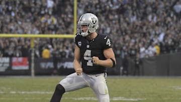 Dec 4, 2016; Oakland, CA, USA; Oakland Raiders quarterback Derek Carr (4) celebrates after a two-point conversion pass in the fourth quarter against the Buffalo Billsduring a NFL football game at Oakland Coliseum. The Raiders defeated the Bills 38-24. Mandatory Credit: Kirby Lee-USA TODAY Sports