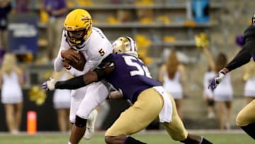 SEATTLE, WA - SEPTEMBER 22: Manny Wilkins #5 of the Arizona State Sun Devils runs with the ball against Ariel Ngata #52 of the Washington Huskies in the second quarter during their game at Husky Stadium on September 22, 2018 in Seattle, Washington. (Photo by Abbie Parr/Getty Images)