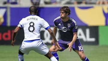 Oct 2, 2016; Orlando, FL, USA; Orlando City FC midfielder Kaka (10) and Montreal Impact midfielder Patrice Bernier (8) battle for the ball during the first half of a soccer match at Camping World Stadium. Mandatory Credit: Reinhold Matay-USA TODAY Sports