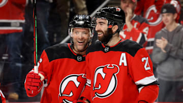 NEWARK, NEW JERSEY - FEBRUARY 08: Andy Greene #6 of the New Jersey Devils congratulates teammate Kyle Palmieri #21 of the New Jersey Devils after he scored a goal in the second period against the Los Angeles Kings at Prudential Center on February 08, 2020 in Newark, New Jersey. (Photo by Elsa/Getty Images)