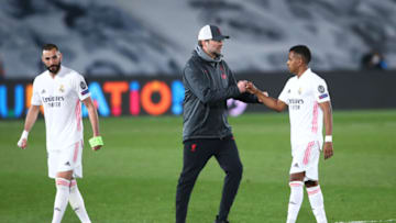 MADRID, SPAIN - APRIL 06: Juergen Klopp, Manager of Liverpool shakes hands with Rodrygo of Real Madrid following the UEFA Champions League Quarter Final match between Real Madrid and Liverpool FC at Estadio Alfredo Di Stefano on April 06, 2021 in Madrid, Spain. Sporting stadiums around Spain remain under strict restrictions due to the Coronavirus Pandemic as Government social distancing laws prohibit fans inside venues resulting in games being played behind closed doors. (Photo by Fran Santiago/Getty Images)
