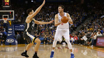 OAKLAND, CA - DECEMBER 23: Danilo Gallinari #8 of the LA Clippers is guarded by Klay Thompson #11 of the Golden State Warriors at ORACLE Arena on December 23, 2018 in Oakland, California. NOTE TO USER: User expressly acknowledges and agrees that, by downloading and or using this photograph, User is consenting to the terms and conditions of the Getty Images License Agreement. (Photo by Lachlan Cunningham/Getty Images)