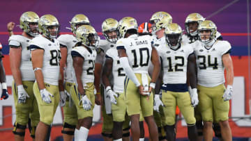 Sep 26, 2020; Syracuse, New York, USA; Georgia Tech Yellow Jackets quarterback Jeff Sims (10) calls a play in the huddle against the Syracuse Orange during the third quarter at the Carrier Dome. Mandatory Credit: Rich Barnes-USA TODAY Sports