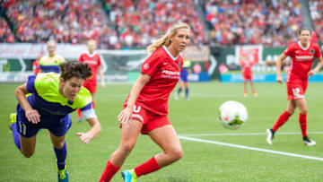 July 22, 2015: Allie Long (10) of Portland Thorns controlling a ball past Keelin Winters (11) of Seattle Reign - Providence Park, Portland OR (Photo by Diego Diaz/Icon Sportswire/Corbis via Getty Images)