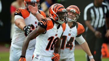Sep 30, 2012; Jacksonville, FL, USA; Cincinnati Bengals wide receiver A.J. Green (18) gets a pat on the helmet from quarterback Andy Dalton (14) and guard Kevin Zeitler (68) after catching a pass for a touchdown during the fourth quarter against the Jacksonville Jaguars at Everbank Field. Mandatory Credit: Jake Roth-USA TODAY Sports